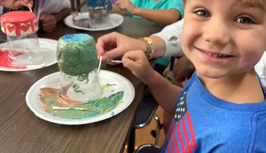 Campers with their painted volcano science projects